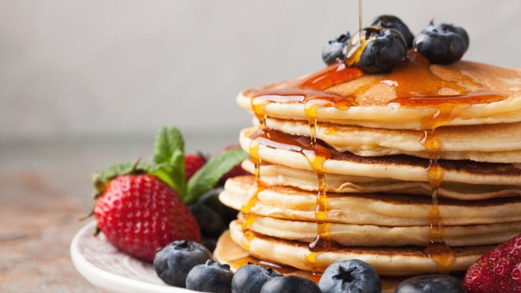Pancake with fresh fruits and maple syrup
