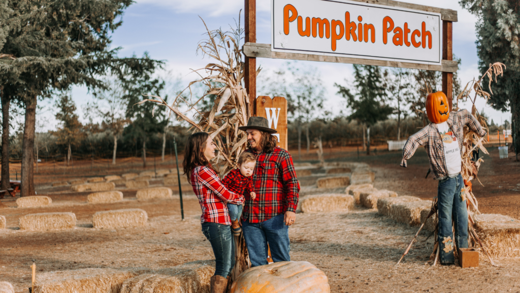 Happy Family in Pumpkin Patch