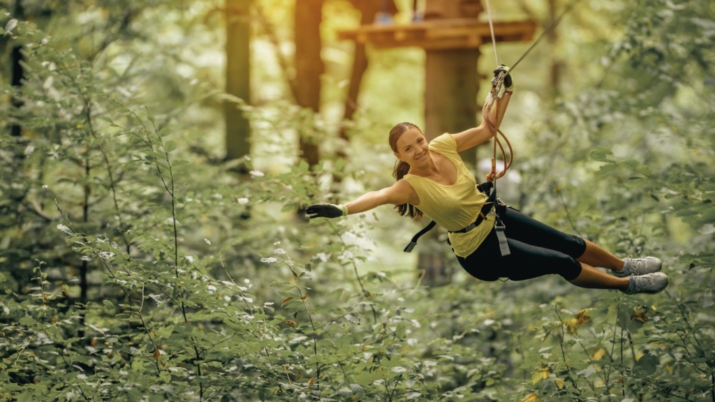 Flying over forest with zip line - Picture by stock_colors from Getty Images Signature