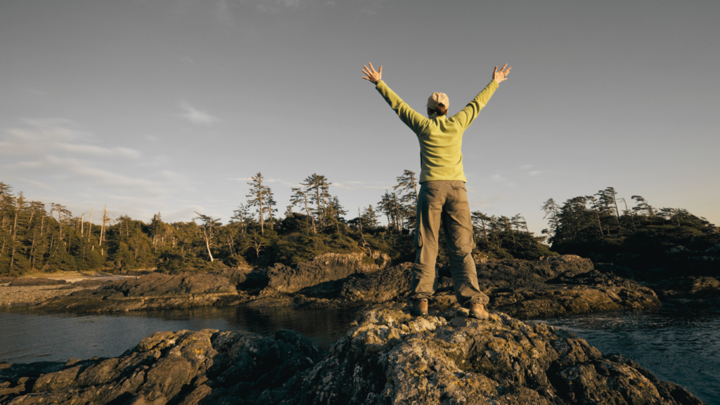 Woman Hiker expressing elation Pacific Rim National Park, Vancouver Island